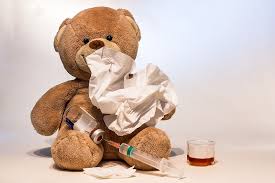 Teddy bear suffering from the flu.