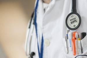 medical doctor wearing a white lab coat